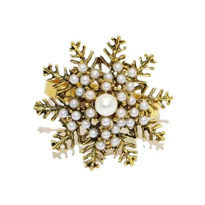 Antique gold snowflake napkin ring with faux pearls, perfect for Christmas table decor.
