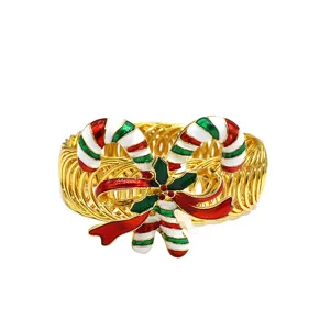 Christmas candy cane curtain buckle detail, gold spring tieback with red and green enamel.
