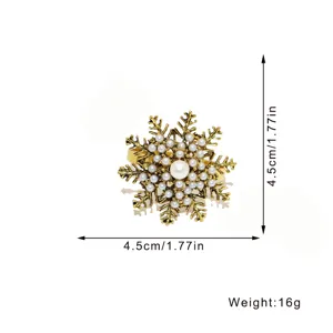 Antique gold snowflake napkin ring with pearls, perfect for Christmas table decor and parties.