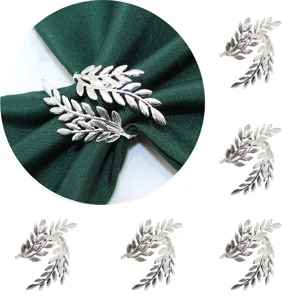 Silver leaf metal napkin rings set, elegant table decor for restaurants and weddings.