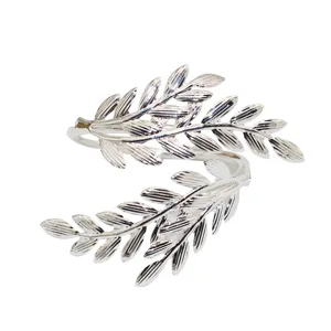 Silver metal leaf napkin ring detail view, elegant table decor napkin buckle for dinner party.