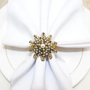 Antique gold snowflake napkin ring with pearls for Christmas table decor and holiday dining.
