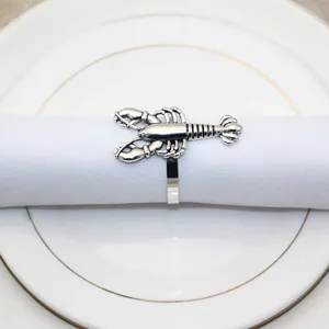 Silver lobster napkin ring detail, elegant marine design for table decor and dining settings.