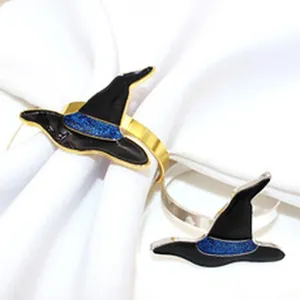 Close-up detail of Halloween witch hat napkin ring featuring sparkling blue enamel finish.