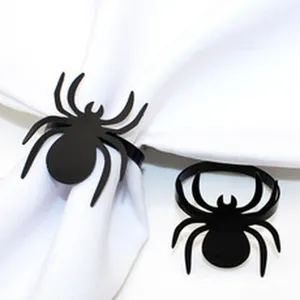Black spider napkin ring for Halloween decoration, gothic style table decor details.
