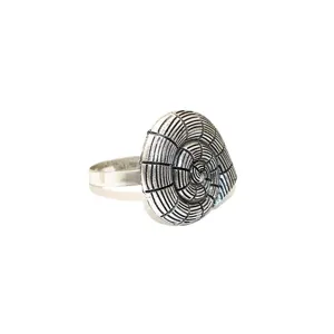Detailed view of vintage silver metal napkin ring featuring exquisite shell spiral design for table.