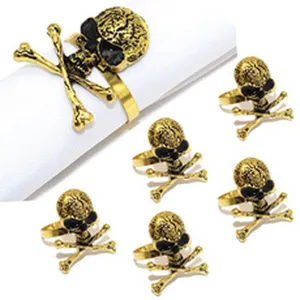 Vintage gold skull napkin rings set of 6, gothic table decor for Halloween and dinner parties.