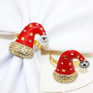 Christmas Santa hat napkin rings with sparkling rhinestones and stars for holiday table decor.