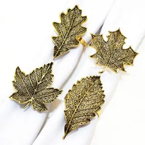 Vintage gold leaf napkin rings set of 4, elegant alloy table decor for autumn, weddings, and Thanksgiving.