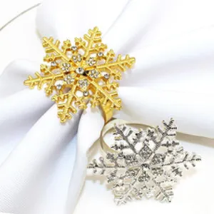 Glittering gold and silver rhinestone snowflake napkin rings for table decor detail view