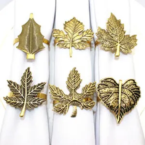 Vintage gold leaf napkin rings set, elegant metal napkin holders for table decor and parties.