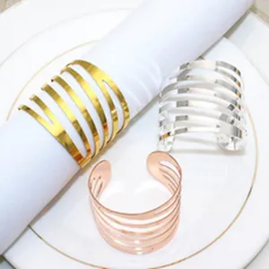 Metal napkin rings set, multi-strand hollow spring design, elegant table decor for dining.
