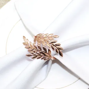 Rose gold leaf napkin ring metal table decor elegant dinner napkin holder detail view.