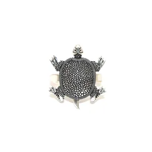 Vintage silver-colored turtle napkin ring detail showing exquisite shell texture and metal craft.