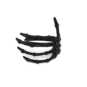 Black skeleton hand napkin ring for Halloween table decor, gothic party dining accessory.