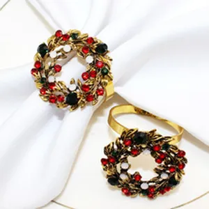 Exquisite alloy Christmas wreath napkin rings with colorful rhinestones for holiday table decor.