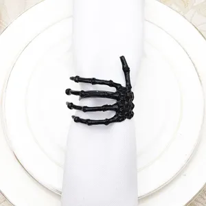 Black skeleton hand napkin ring for Halloween table decor, gothic spooky party dining accessory.