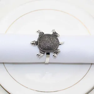 Silver turtle napkin ring detail shot, vintage metal marine life tableware decor for home dining.