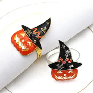 Halloween pumpkin witch hat napkin rings detailed view, elegant alloy metal table decor for party.