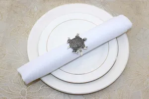 Vintage turtle napkin ring metal table decor detail closeup for dining table setup