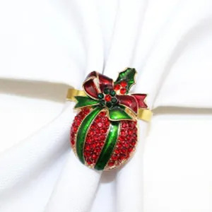 Detailed close-up of a Christmas crystal napkin ring featuring red and green rhinestones and bow.