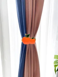 Fermatenda decorativo in metallo con design a zucca arancione, elegante accessorio per casa.