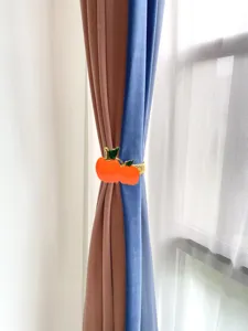Fermatenda a molla in metallo creativo con decorazione di frutta arancione per la casa.