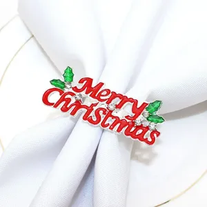 Elegant Christmas napkin ring with red Merry Christmas lettering, rhinestones, and green leaves.