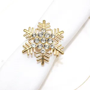 Gold tone rhinestone snowflake napkin ring detail shot for elegant holiday table decor.