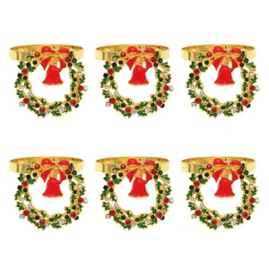 Gold Christmas wreath napkin rings set with red bell and sparkling crystal rhinestones.