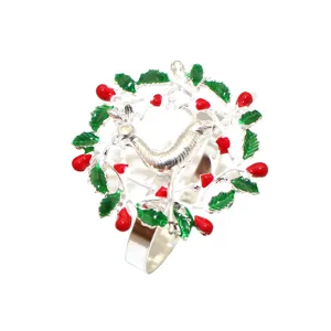 Christmas napkin ring silver metal holiday table decor with red berries and green leaves design.