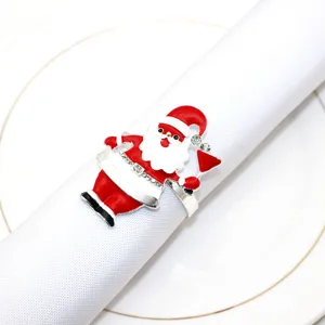 Detailed view of rhinestone Santa Claus napkin ring, silver metal holiday table decor.