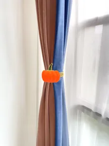 Orange pumpkin curtain tieback metal spring clip for home decor and Thanksgiving window styling.