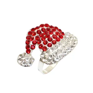 Detailed view of sparkly rhinestone Santa hat napkin ring, elegant silver tone hotel table decor.