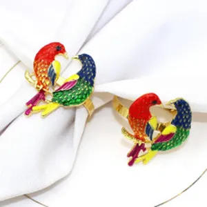Bellissimi portatovaglioli in metallo smaltato con uccelli colorati per feste.