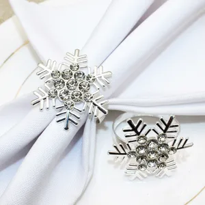 Silver snowflake napkin rings set crystal table decor for hotel Christmas dinner party.