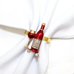 Detailed view of alloy red wine bottle napkin ring with sparkling rhinestones for hotel decor.
