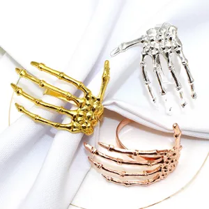 Skeleton hand napkin rings set, gothic table decor for Halloween party and dinner events.