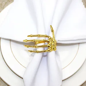 Gold skeleton hand napkin ring for Halloween table decor, elegant gothic dining accessory