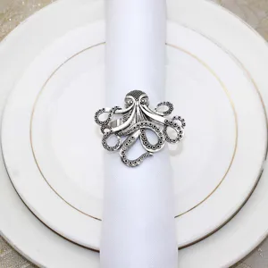 Vintage silver metal octopus napkin ring detail shot, perfect for elegant marine themed table decor.