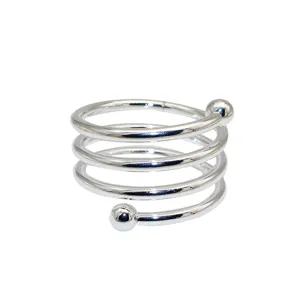 Close-up detail of a silver metal spiral napkin ring featuring a unique double ball design.