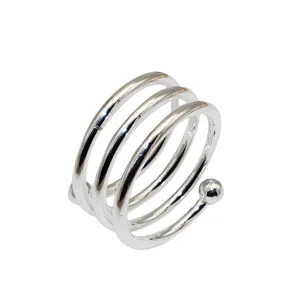 Silver metal spiral napkin ring holder, modern multi-loop table decor for hotel dining.