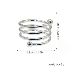 Silver metal spring napkin ring with double ball ends, elegant table decor for hotel dining.