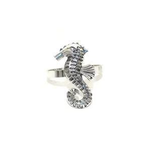 Vintage silver metal seahorse napkin ring detail, perfect for summer marine table decor.