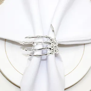 Silver skeleton hand napkin ring for Halloween table decor, gothic dining table accessory.