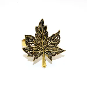 Detailed close-up view of the vintage gold maple leaf napkin ring with clear textured veins.