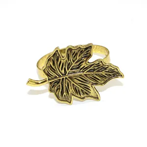 Close-up detail of the antique gold maple leaf napkin ring, showcasing exquisite leaf texture.