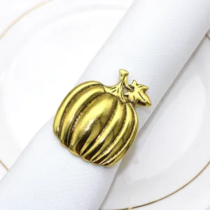 Gold pumpkin napkin ring holder, antique metal autumn table decor for Thanksgiving dinner.