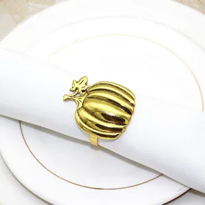 Gold pumpkin napkin ring detail view, antique alloy table decor for Thanksgiving dinner.