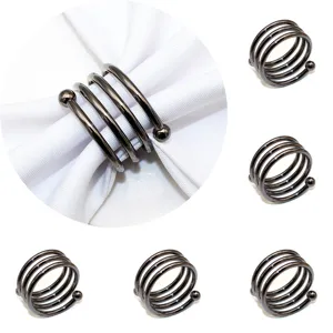 Metal spring napkin ring with double bead ends, stylish table decor for hotel dining set.